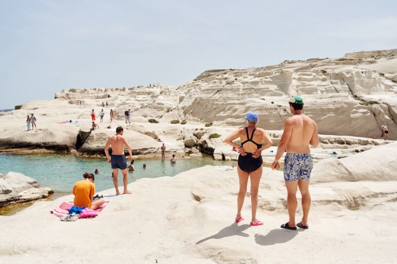 people on white grotto beach